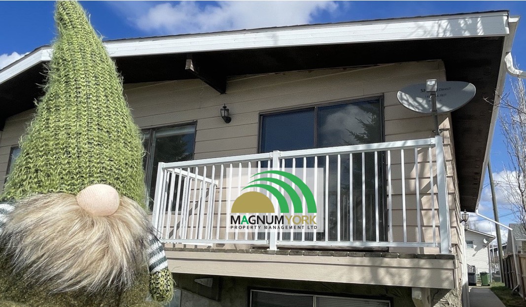 Gnorman Magnome in front of a rental property in Olds Alberta